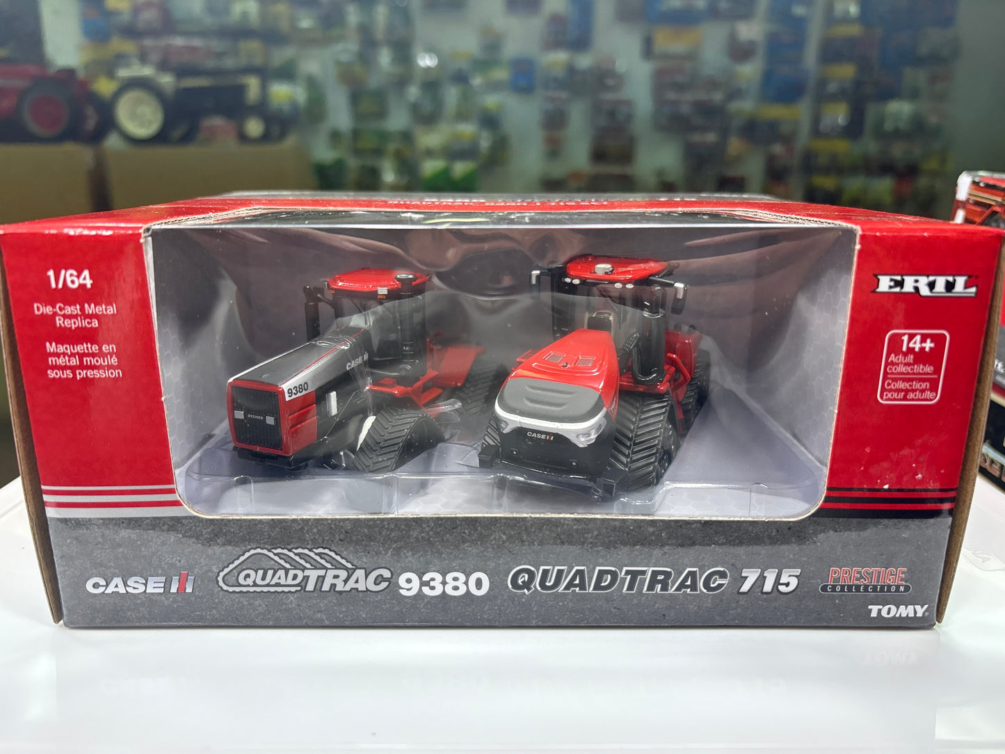 Model tractors in packaging with ERTL branding