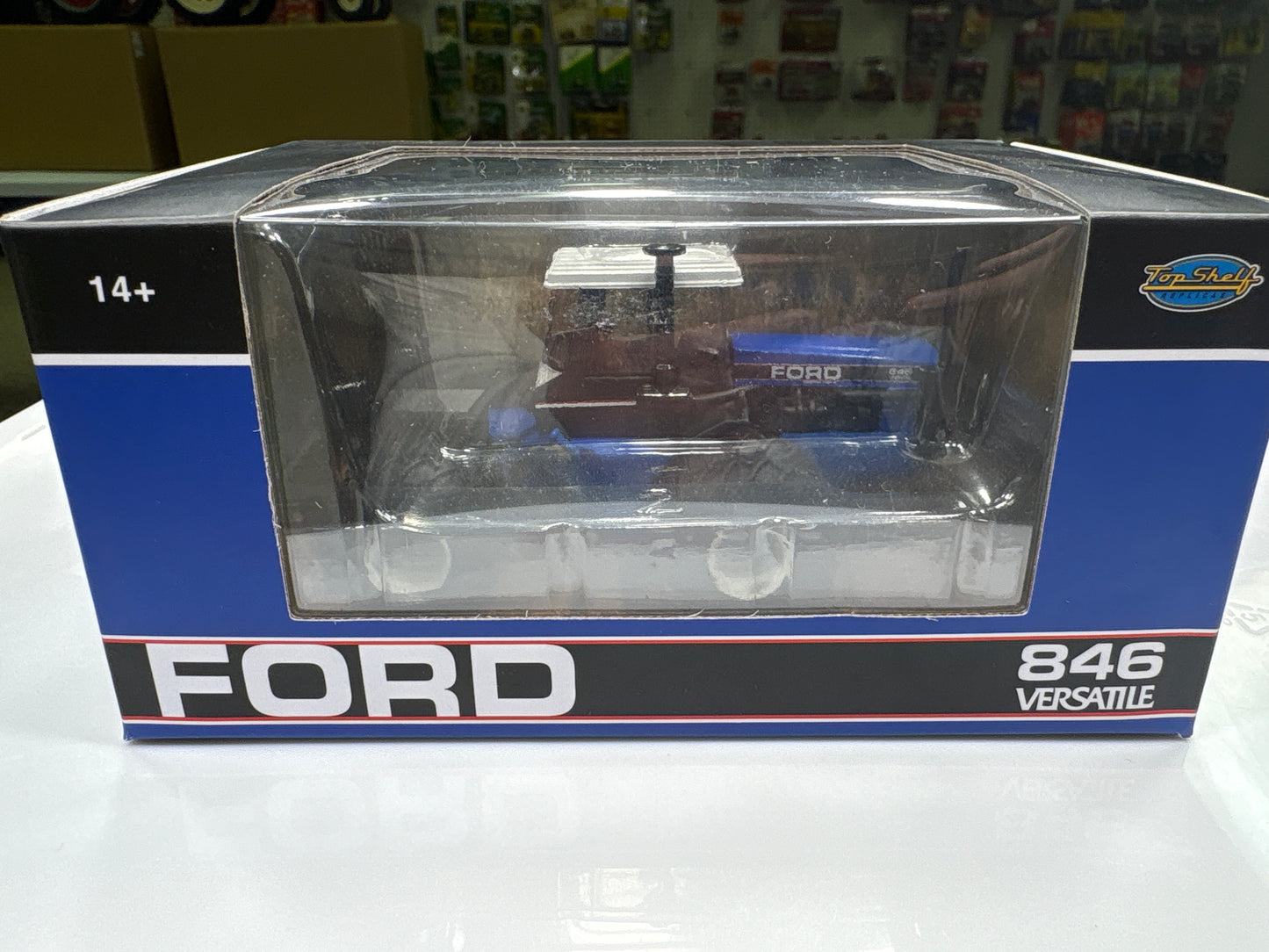Model of a Ford 846 Versatile tractor in packaging