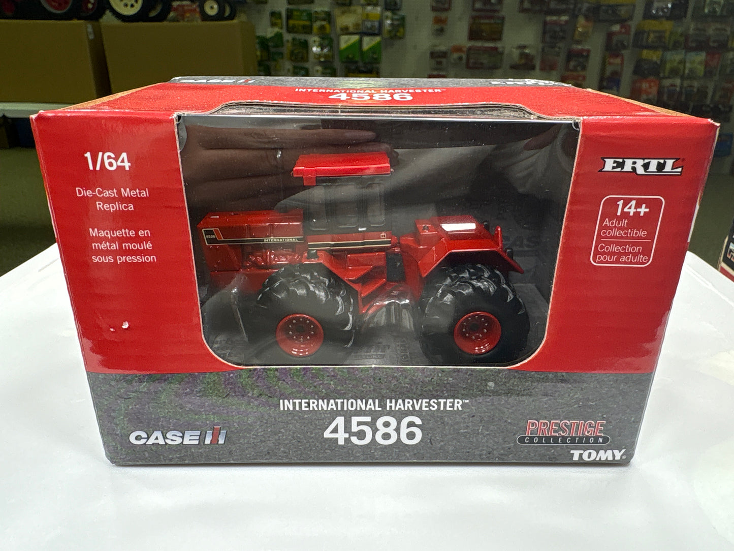 Boxed toy tractor model of Case IH International Harvester 4586 with branding on a white surface.