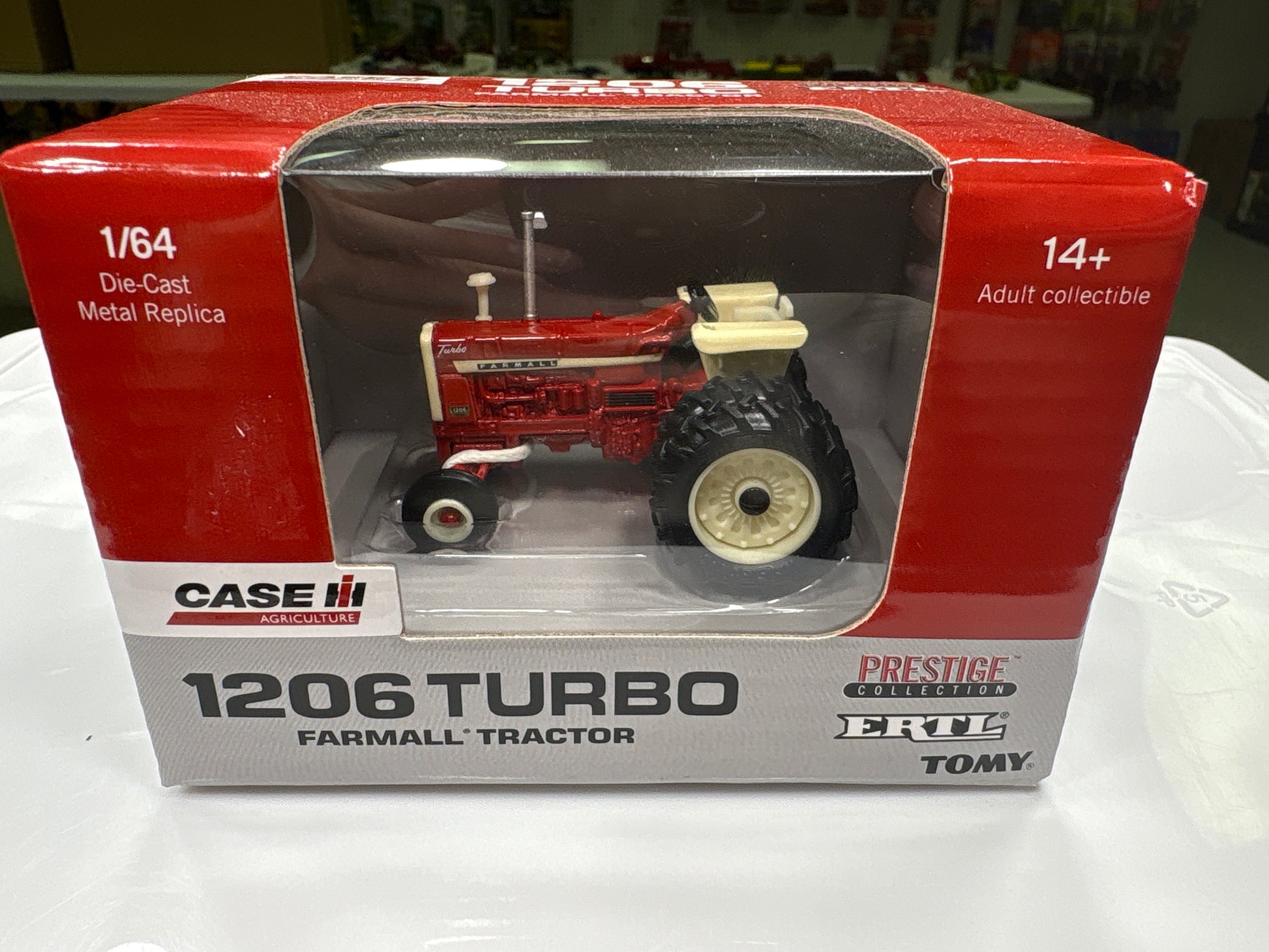 Boxed Case IH 1206 Turbo farmall tractor model on a white surface