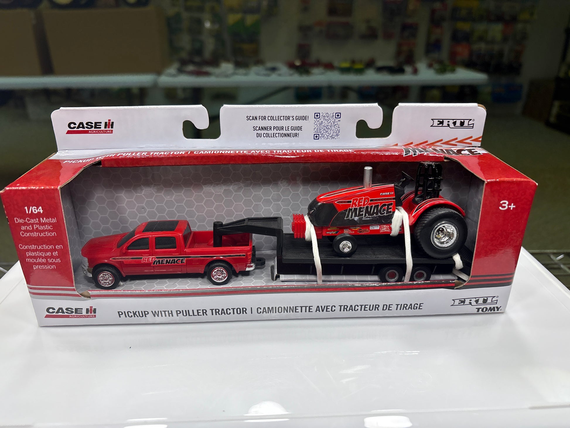 Model truck set in packaging with 'Case' branding on a white surface.
