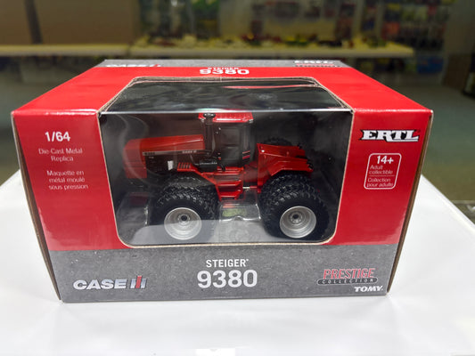 Model tractor in a red and gray box with ERTL branding