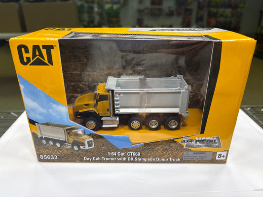 Toy dump truck in packaging with Caterpillar logo