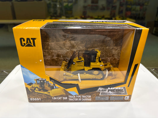 Boxed model of a Caterpillar tractor with clear window
