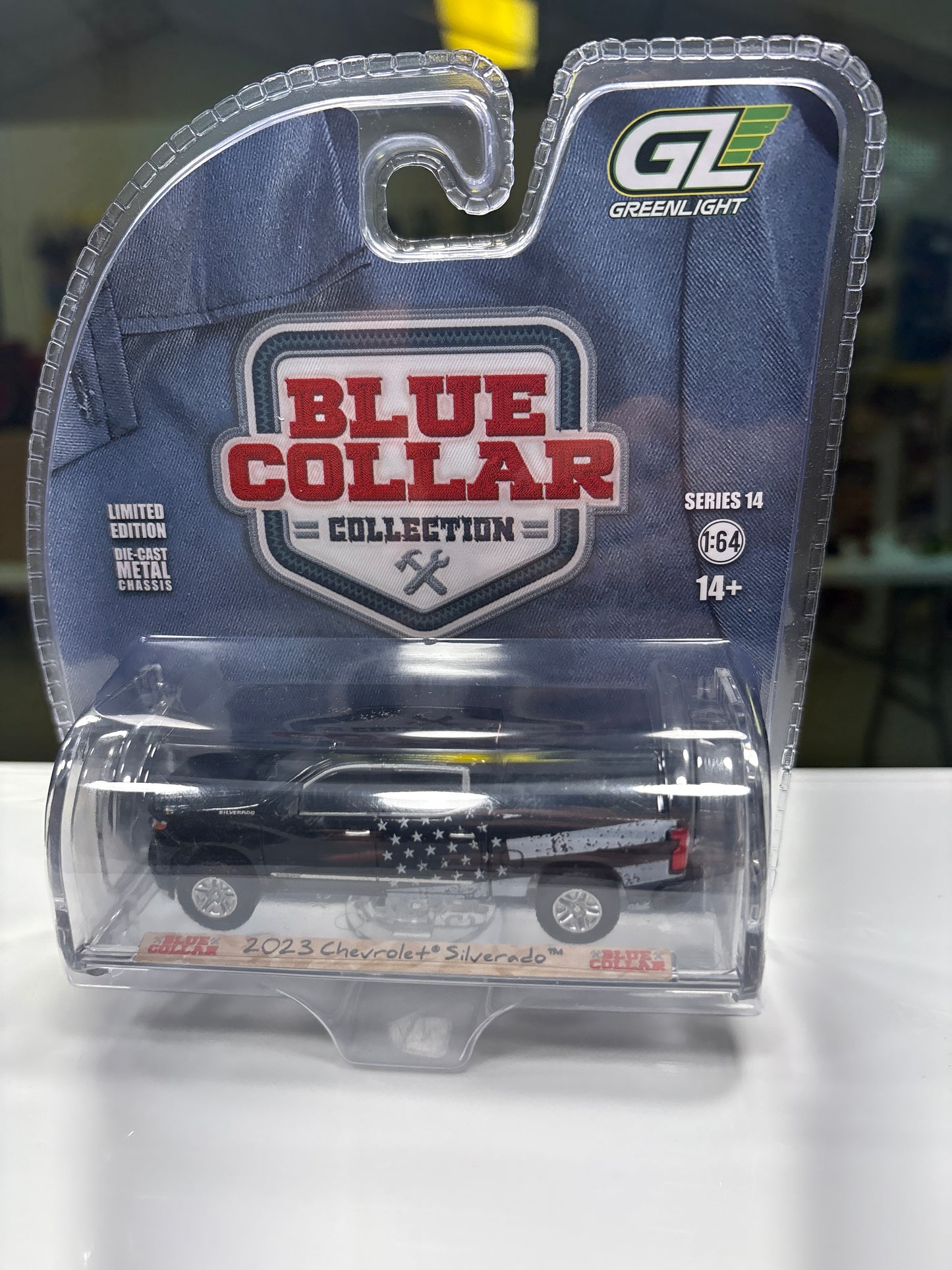 Toy Pickup in clear packaging with Blue Collar logo on a white background
