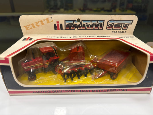 Boxed Ertl Farm Set with die-cast metal replicas of farm vehicles.