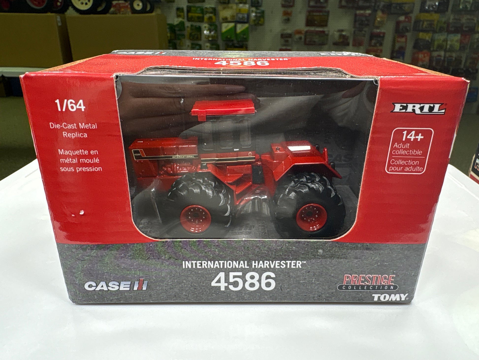 Boxed toy tractor model of Case IH International Harvester 4586 with branding on a white surface.