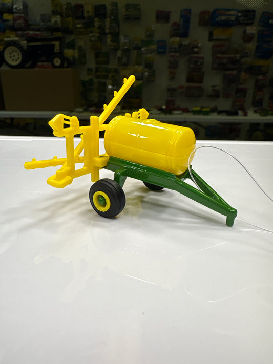 Farm toy on a white surface with a blurred background