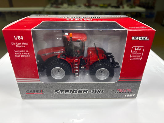 Model tractor in a red and gray box with ERTL branding