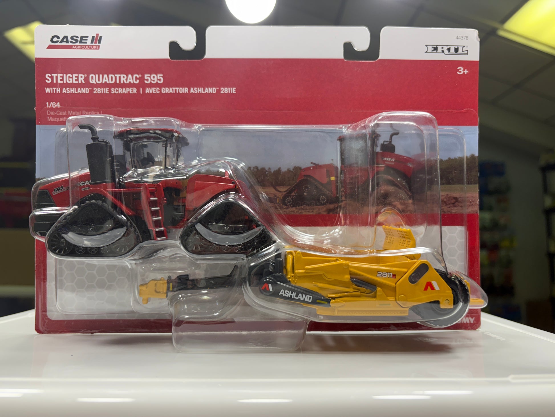 Model tractor and scraper set in packaging with Case logo