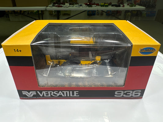 Model tractor in packaging with 'Versatile' branding on a white surface.