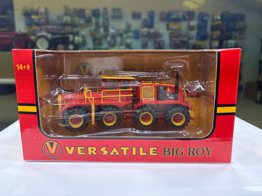 Model of a red and yellow Versatile Big Roy tractor in packaging with visible branding.